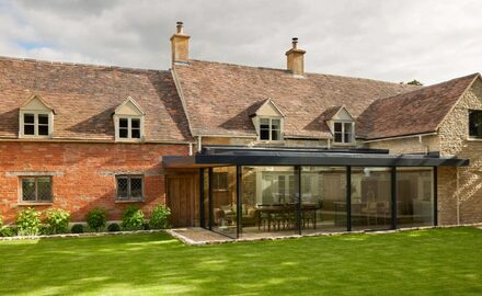 Frameless Glass Extension to Grade II Listed House - Old Mullions